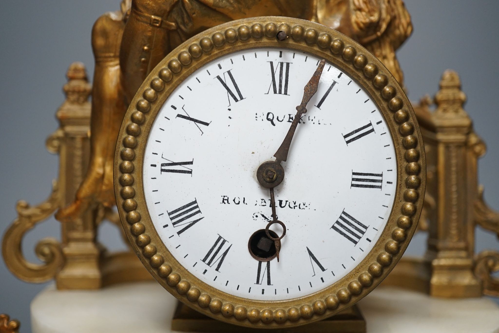 A 19th century French gilt spelter and Alabaster mantel clock, with pendulum, 36cms high.